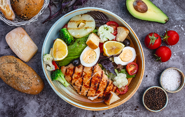 Breakfast: salad with grilled chicken, broccoli, cauliflower, tomatoes, lettuce, avocado