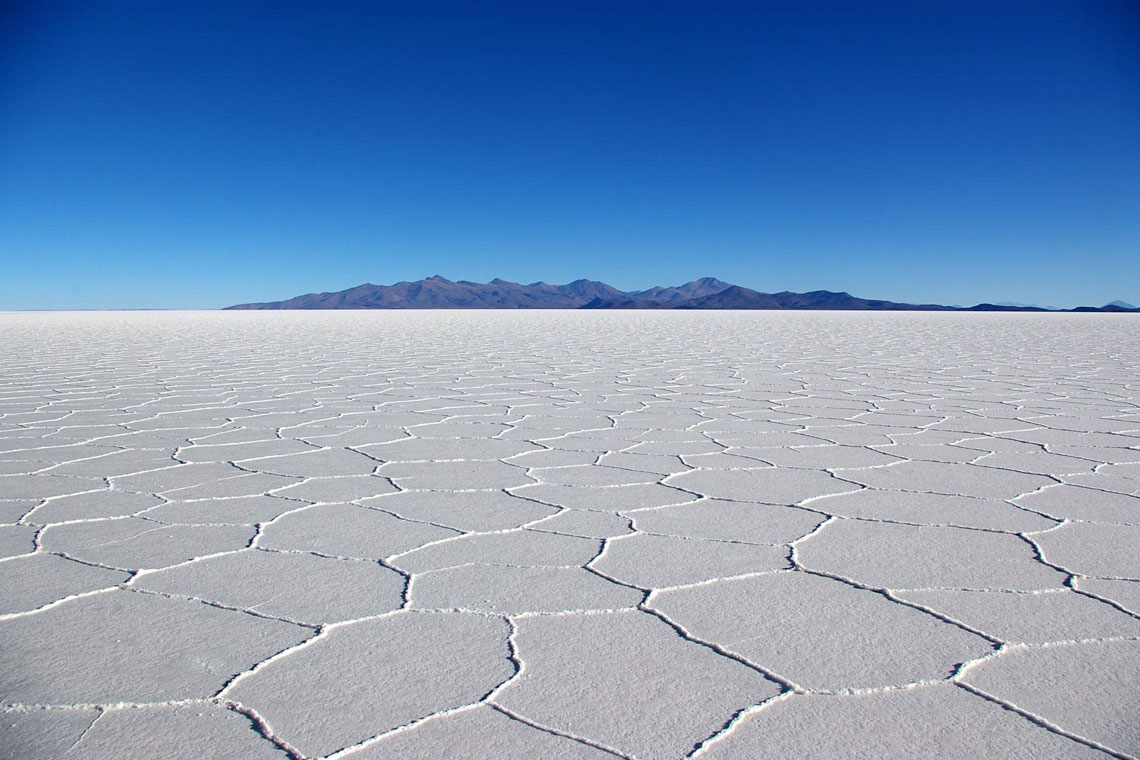 Due to its large size, flat surface and high albedo (characteristic of the diffuse reflectivity of a surface) in the presence of a thin layer of water, as well as minimal change in altitude, the Uyuni Salt is an ideal tool for testing and calibrating remote sensing instruments on orbiting satellites. The clear skies and dry air of Uyuni allow satellites to be calibrated five times more accurately than using the ocean surface.