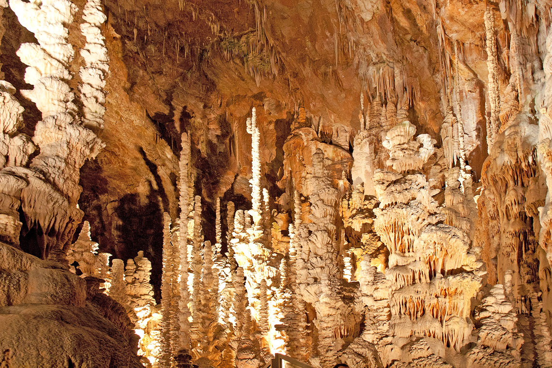 The floor is covered in many fragile limestone formations of various shapes and sizes, created by the slow dripping of water through the stone over millennia. Some of these stalagmites reach a height of 30 meters.